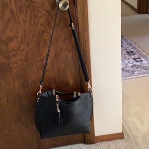 Black Vegan leather cross-body purse.